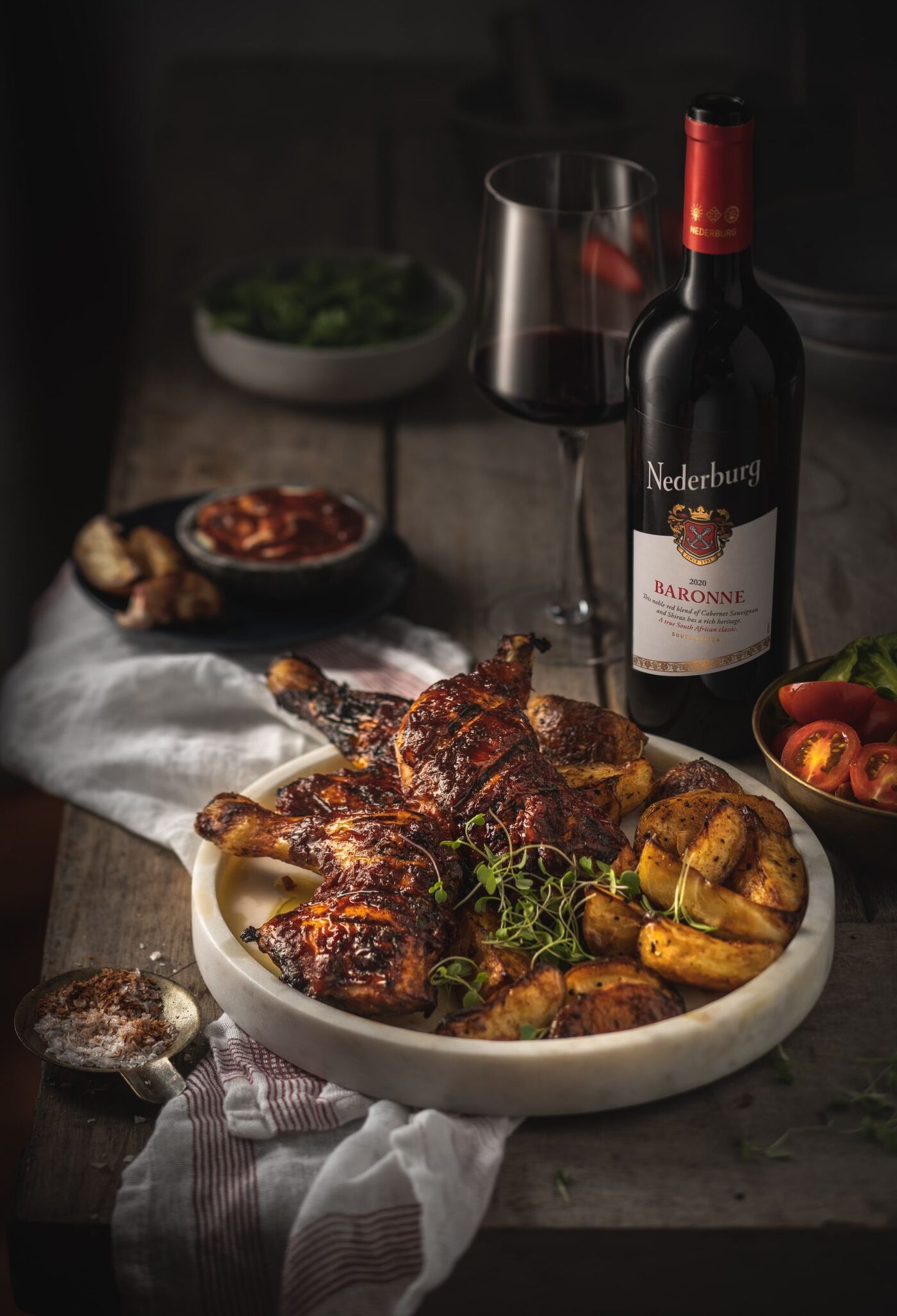 Juster fodbold retning Quarter chicken in a red wine marinade and spicy potato wedges, with  Nederburg Baronne (Cabernet Sauvignon/Shiraz)
