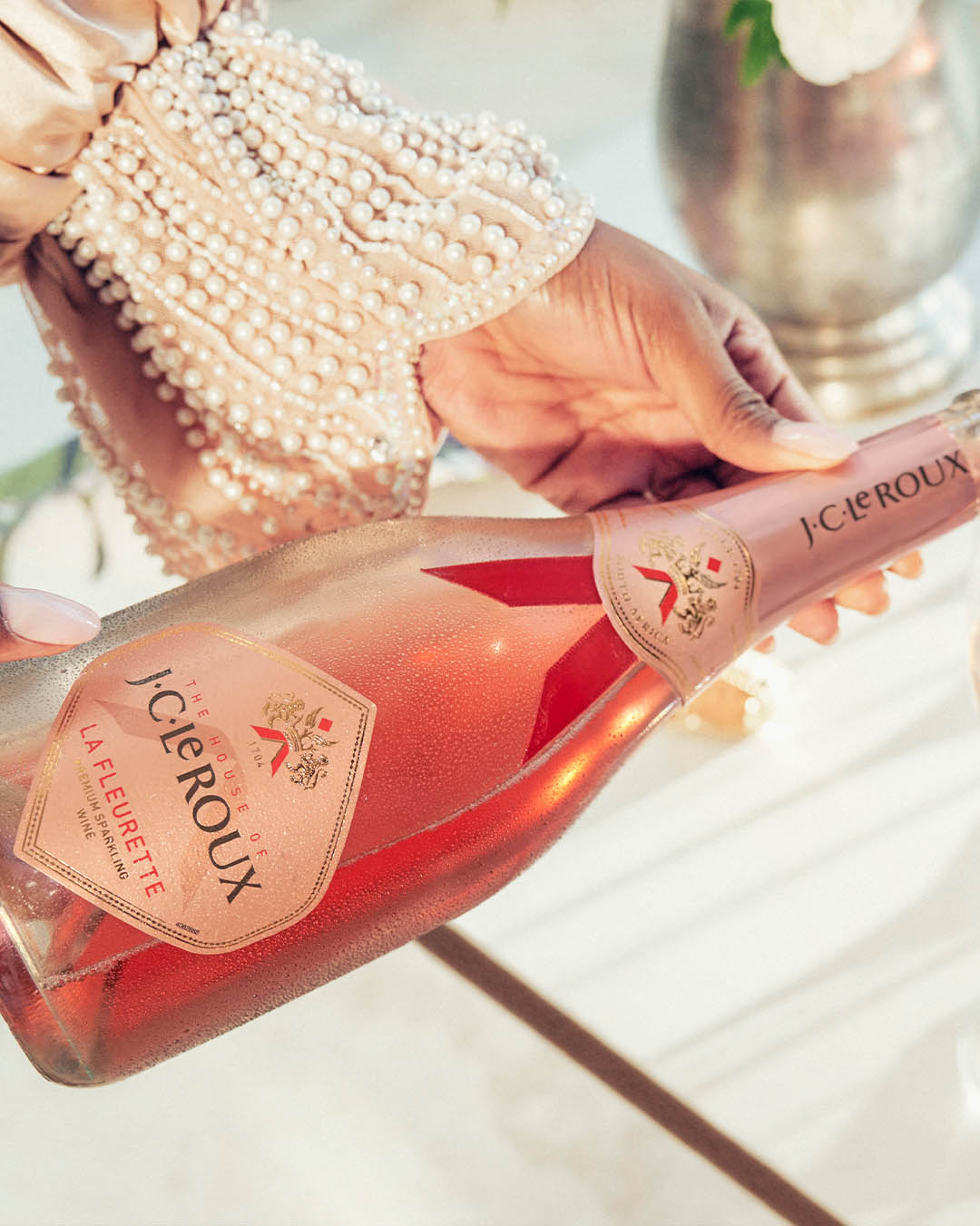 friends celebrating and enjoying jc le roux sparklign wine